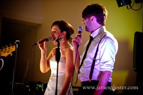 Emma and Andy sing together at the wedding reception