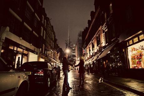 Hands held tight across a glistening London street