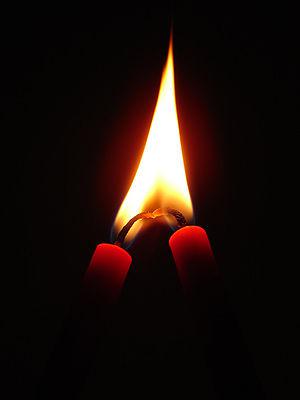 Two candles in love. The flame is inverted hea...