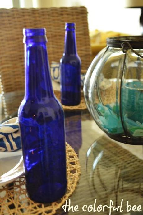 blue bottles and beachglass tablescape
