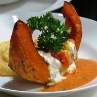 Gem Pampoen Roasted Butternut Squash stuffed with gost cheese and pine nuts served with Ugali