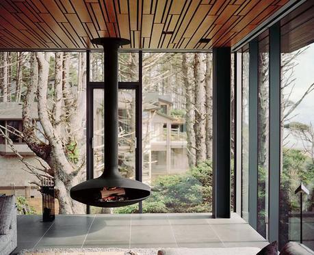 Cannon Beach home living room with euroflues stove and glass curtains