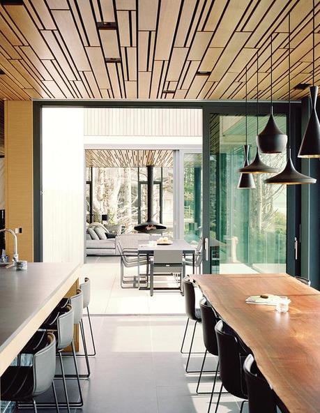 Cannon Beach home with basalt tile floors and white oak plank ceilings in the kitchen dining space
