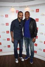 Sports superstars Tony Parker andThierry Henry smile from the Emirates Suite