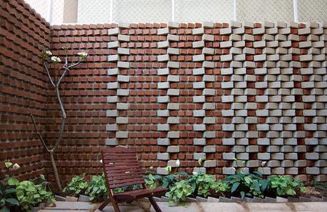 Bangalore, India house with green, earth bricks in their backyard garden