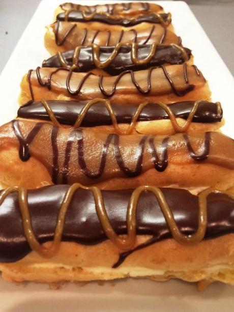 chocolate and caramel choux pastry eclairs piped icing finish