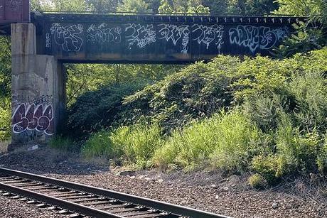 tags and throwies on a railroad bridge.jpg