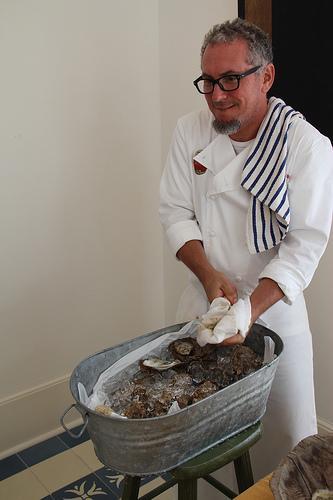 Chef Scwartz Shucking Oysters at Studio b. Alys Beach