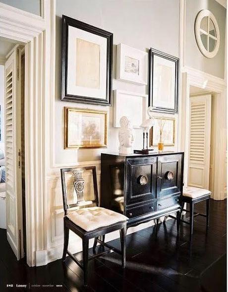 hallway vignette black floors lacquer chest gallery wall