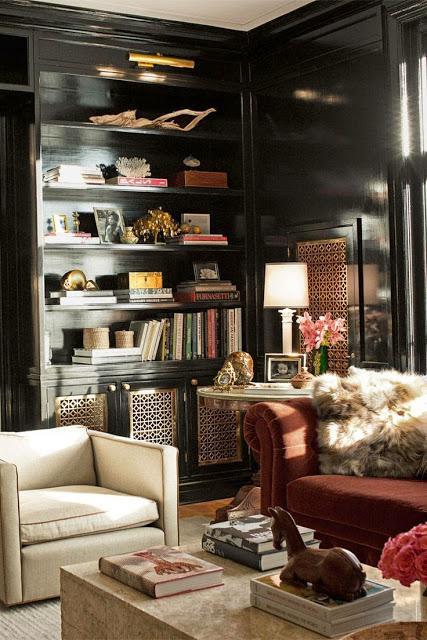 black lacquer bookcases in traditional study den