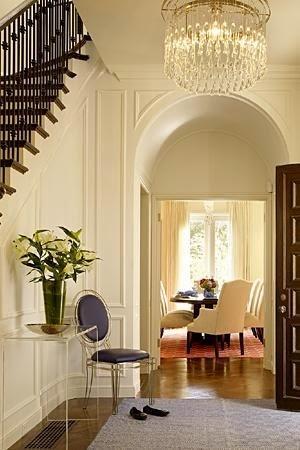 beautiful arched door in traditional foyer
