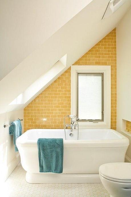 Love the angled ceiling, yellow subway tile and the pop of color with the towels. Renewal Design Build.