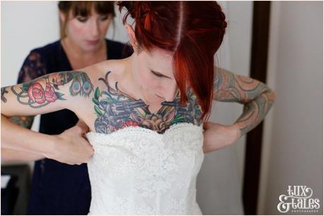 Wedding Photography at The Orangery Wakefield | Tattooed Bride | Bride Preparation | Tux & Tales Photography | bride gets into dress