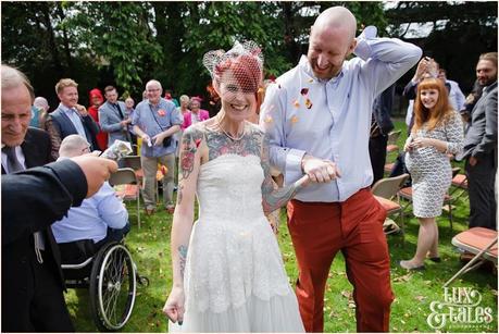 Wedding Photography at The Orangery Wakefield | Tattooed Bride | Outside ceremony | Tux & Tales Photography | walking back up aisle with confetti