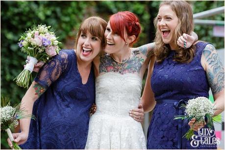 Wedding Photography at The Orangery Wakefield | Tattooed Bride | Oragami & taxidermy themed wedding | Tux & Tales Photography | bride smiling with bridesmaids