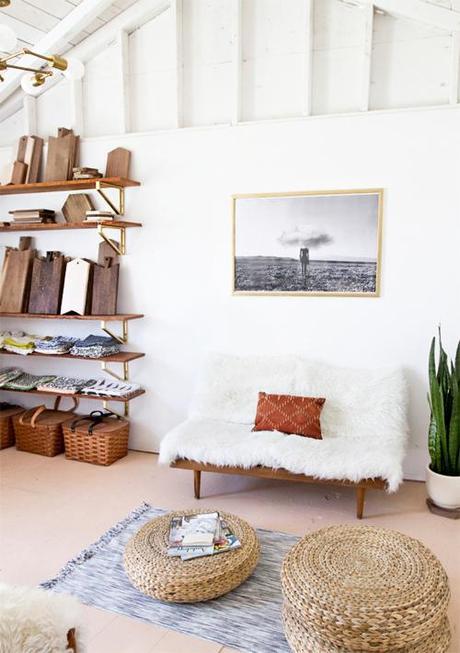 Workspace With Wood Shelves Sheepskin Sofa Statement Art