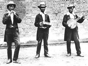 Street minstrels in London circa 1880