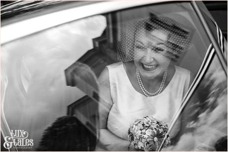 Lake District Wedding Photographer | Derwentwater Youth Hostel Wedding | Alternative eclectic wedding styling | Tux & Tales Photography | Ceremony | Bride smiling as she arrives in car