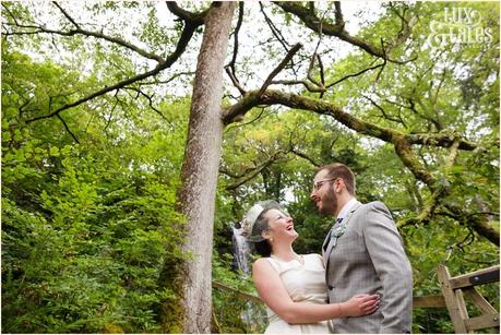 Lake District Wedding Photographer | Derwentwater Youth Hostel Wedding | Alternative eclectic wedding styling | Tux & Tales Photography | Bride & Groom Portraits in the Woods Near Waterfall |
