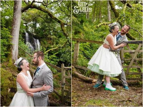 Lake District Wedding Photographer | Derwentwater Youth Hostel Wedding | Alternative eclectic wedding styling | Tux & Tales Photography | Bride & Groom Portraits in the Woods Near Waterfall | Laughing