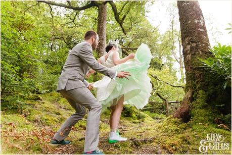 Lake District Wedding Photographer | Derwentwater Youth Hostel Wedding | Alternative eclectic wedding styling | Tux & Tales Photography | Bride & Groom Portraits in the Woods Near Waterfall | Twirling in dress