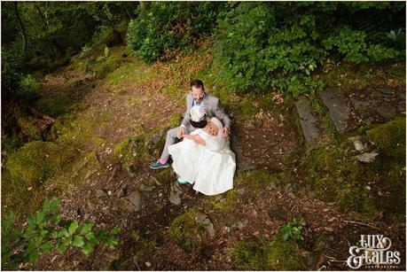 Lake District Wedding Photographer | Derwentwater Youth Hostel Wedding | Alternative eclectic wedding styling | Tux & Tales Photography | Bride & Groom Portraits in the Woods Near Waterfall |