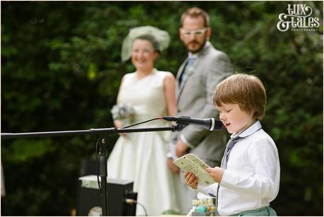 Lake District Wedding Photographer | Derwentwater Youth Hostel Wedding | Alternative eclectic wedding styling | Tux & Tales Photography | Ceremony | Bride & groom watch son giving speech