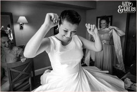 Lake District Wedding Photographer | Derwentwater Youth Hostel Wedding | Alternative eclectic wedding styling | Tux & Tales Photography | Bride Preparation | Bride spins in her dress