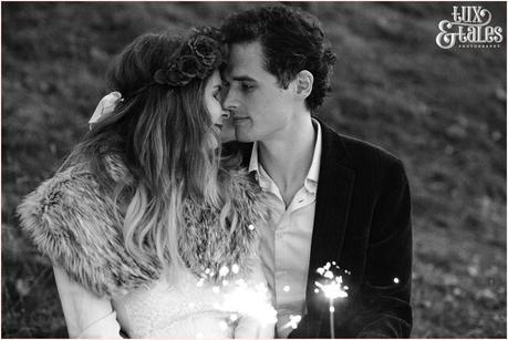 Photography Engagement Shoot in Whitby | Girl wearing Red Flower crown | Alterntive Couple whereing Vintage clothing | Kissing with sparklers