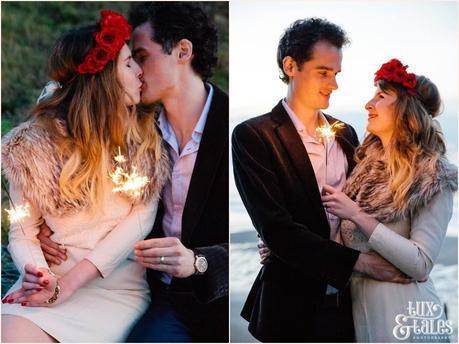 Photography Engagement Shoot in Whitby | Girl wearing Red Flower crown | Alterntive Couple whereing Vintage clothing |Kissing with sparklers