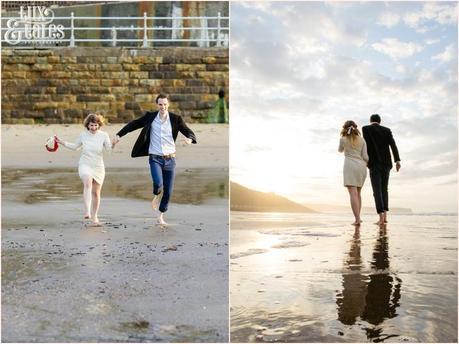 Photography Engagement Shoot in Whitby | Girl wearing Red Flower crown | Alterntive Couple whereing Vintage clothing | Couple running on the beach | Reflections on the water