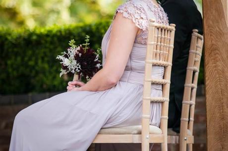 Double up bridesmaid posies as table flowers to stay within budget