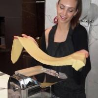 Sarah rolling fresh pasta sheet