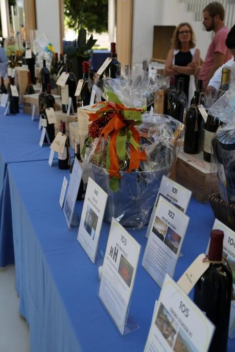 The wine auction table is packed with goodies!