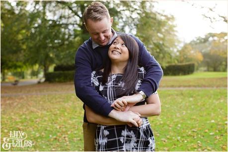 Engagement Shoot in Valley Gardens in Autumn | A couple have fun in the autumn leaves | Copyright Tux & Tales Photography