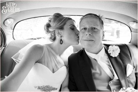 Leeds church wedding photography bride kisses dad in car