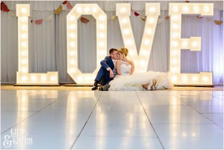 The Priory Cottages Wedding Photography Leeds - Bride & Groom Portrait in front of light up love letters