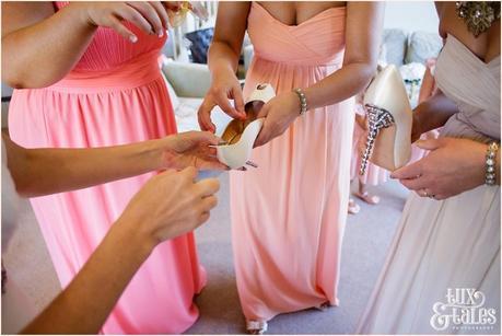 The Priory Cottages Wedding Photography Bride preparation silver sizpence in shoes