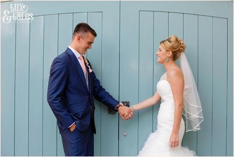 The Priory Cottages Wedding Photography Leeds - Bride & Groom Portraits standing in front of turquoise door