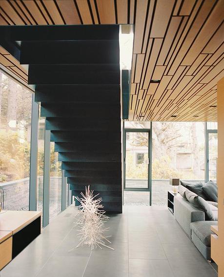 Cannon Beach home with basalt tile floors and white oak plank ceilings and staircase