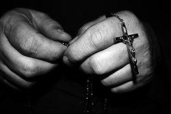 Hands-with-rosary-beads