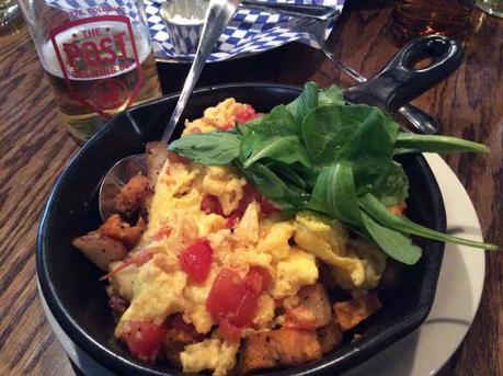 Vegetable Hash Scramble: eggs, roasted tomato, root vegetables, arugula. With a Howdy Beer (Pilsner).
