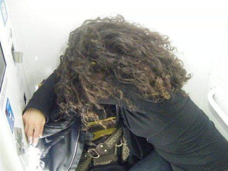 The Story of Elio – Milan. Here I am in the little photo booth for passport pictures!