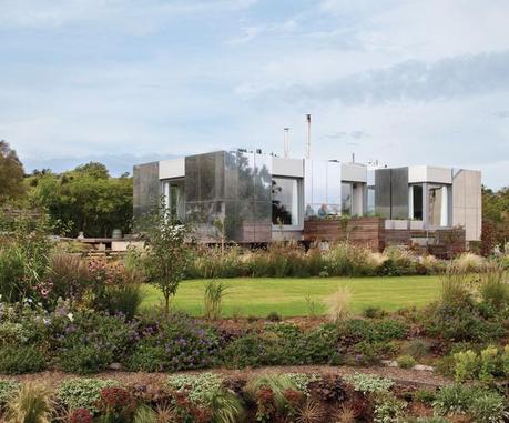 Landscape home facade with sliding aluminum panels