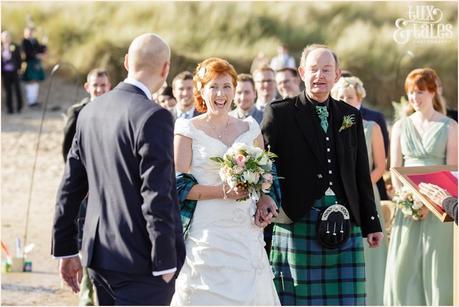Ceremony Photography at Newton Hall beachside wedding | Blue green tartan