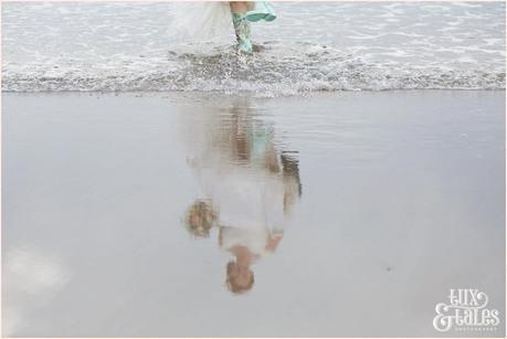 Bride & Groom Portraits in the rain at Newton Hall beachside wedding photography