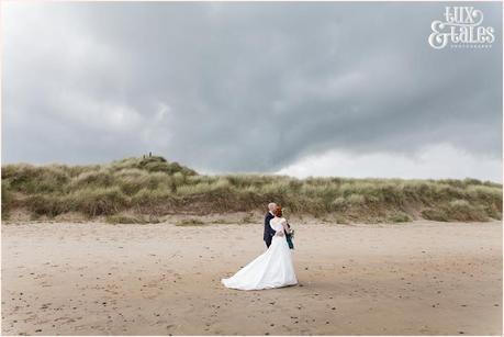Bride & Groom Portraits in the rain at Newton Hall beachside wedding photography