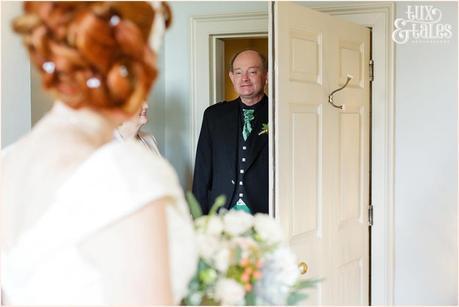 Bride Preparation Photography at Newton Hall beachside wedding | Dad looking at bride