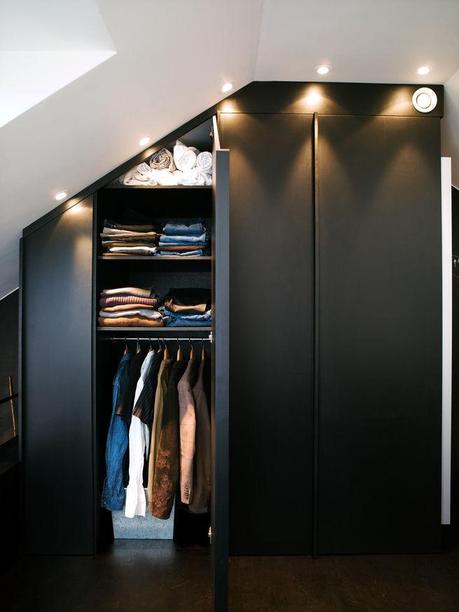 Modern built-in closets with side mirrors and lighting