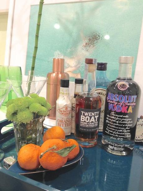 StyleCarrot's Home Bar With Turquoise Lacquer Tray And Absolut Warhol